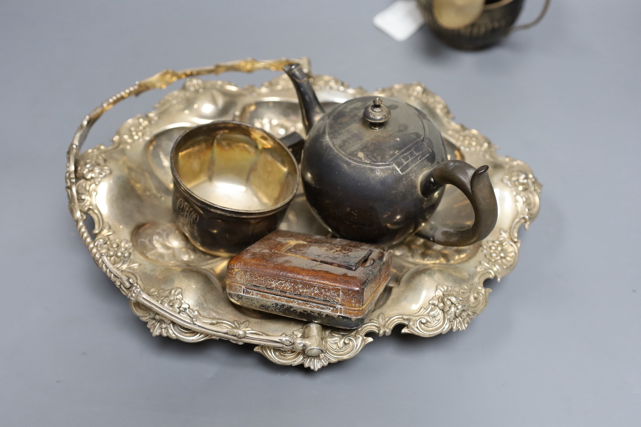 Assorted silver including a Victorian bullet shaped teapot, Arthur Sibley, London, 1878, height 12.1cm, sauceboat, cream jug, sugar bowl, cup, tea strainer, watch holder, match sleeve, pair of ashtrays, lighter, three na